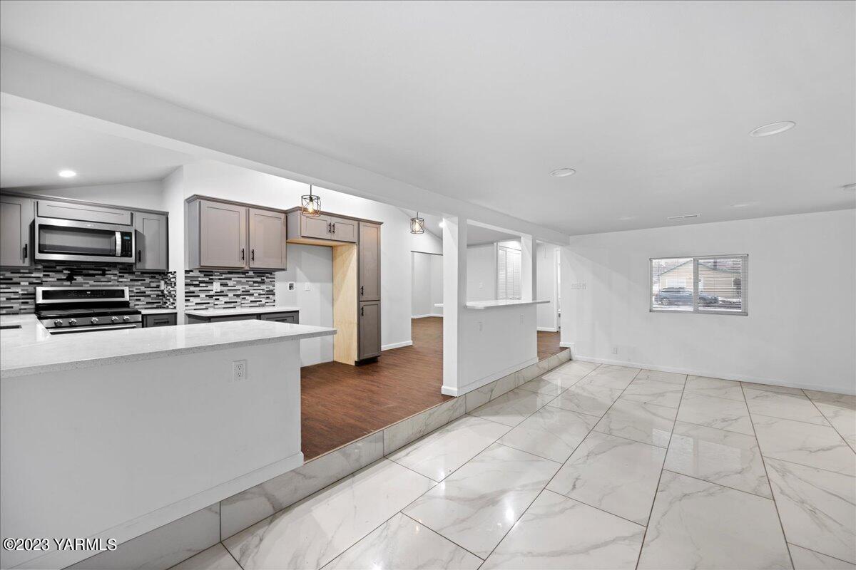 191 Klockhamer Road Naches, WA 98937 - Photo 27 of 28 a view of a kitchen with wooden floor and electronic appliances