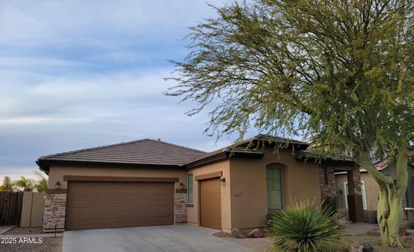 a house with a tree in front of it
