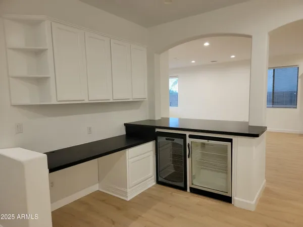 a kitchen with stainless steel appliances granite countertop a sink and a stove