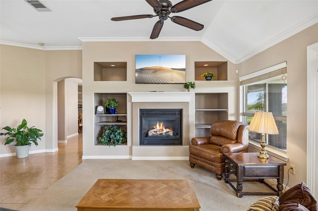 9221 Perimeter Street Denton, TX 76207 - Photo 6 of 36 a living room with furniture and a fireplace