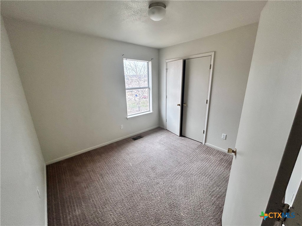 4103 Wine Cup, Unit C Copperas Cove, TX 76522 - Photo 6 of 8 a view of an empty room with a window