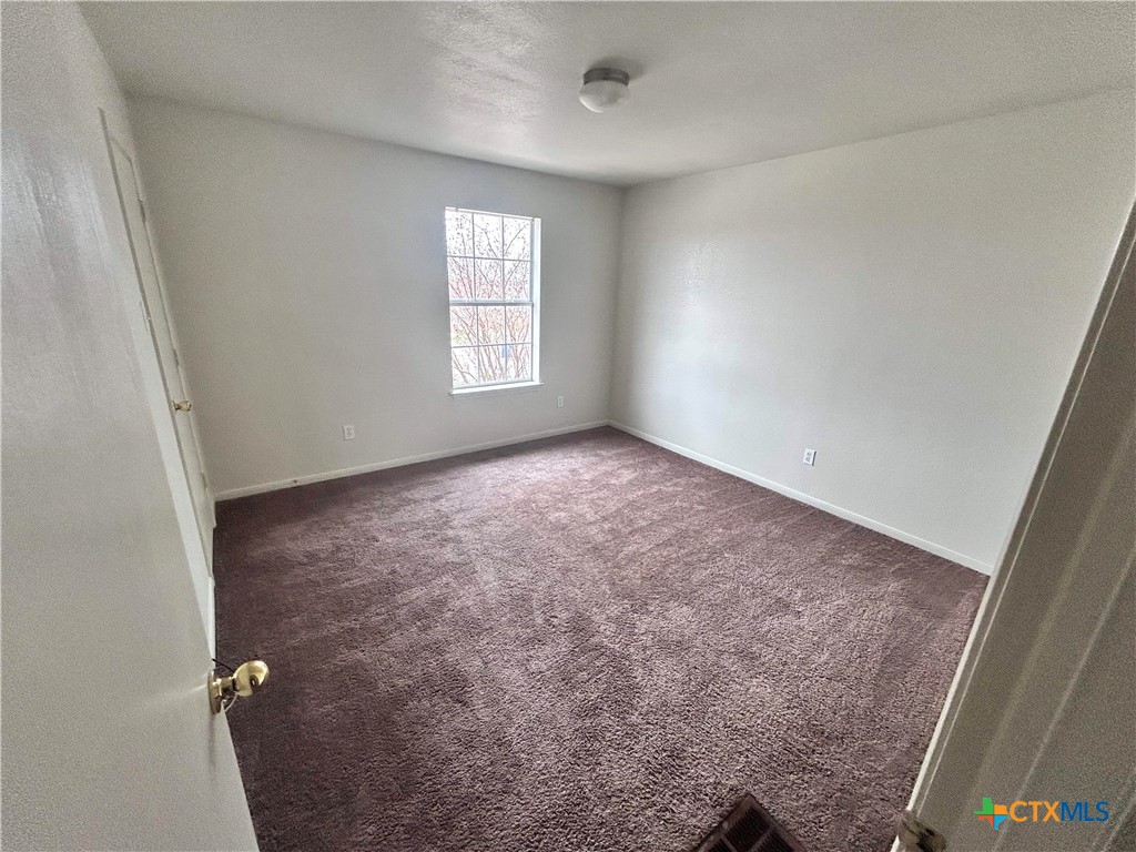 4103 Wine Cup, Unit C Copperas Cove, TX 76522 - Photo 8 of 8 an empty room with windows