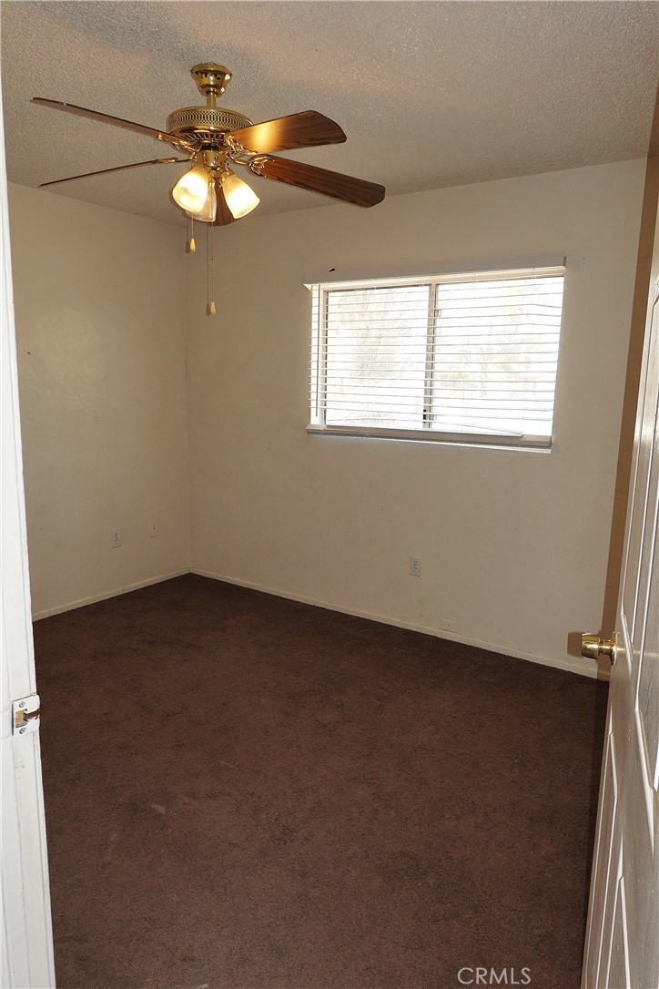 10403 Buckboard Circle Adelanto, CA 92301 - Photo 12 of 20 an empty room with a window