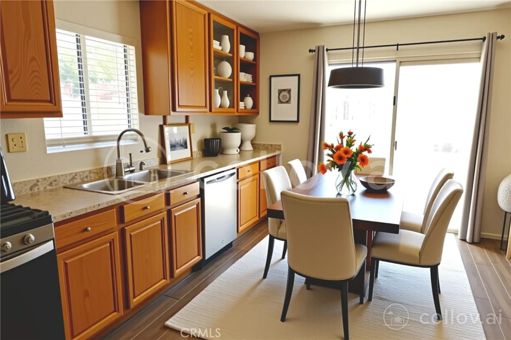 10403 Buckboard Circle Adelanto, CA 92301 - Photo 19 of 20 a dining room with stainless steel appliances granite countertop a dining table chairs a refrigerator and a sink