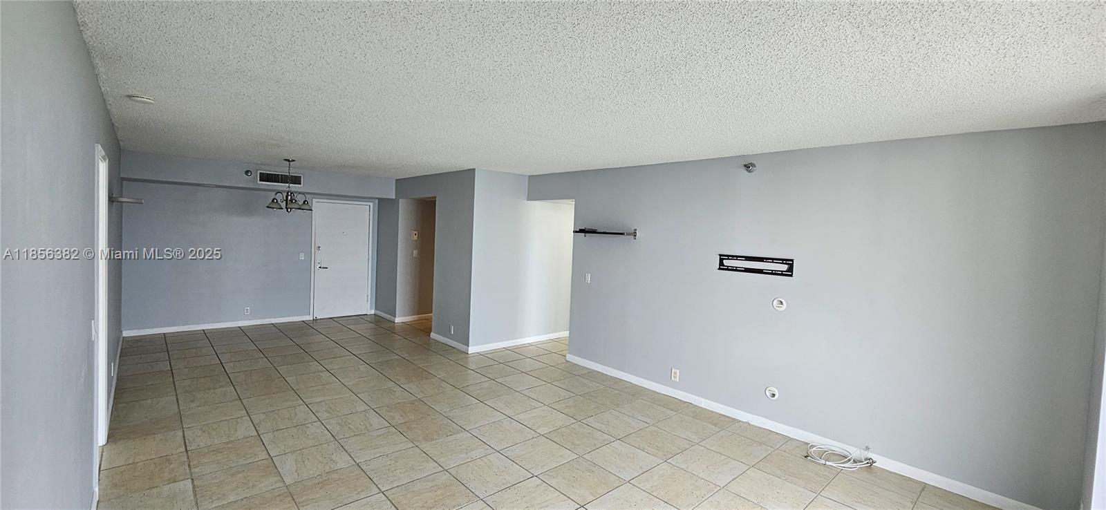 3300 Northeast 191st Street, Unit PH8 Aventura, FL 33180 - Photo 11 of 35 an empty room with shelves