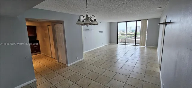 wooden floor in an empty room with a bathroom