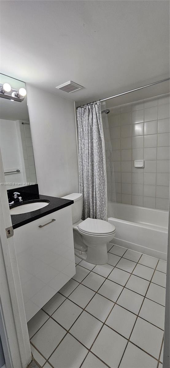 3300 Northeast 191st Street, Unit PH8 Aventura, FL 33180 - Photo 22 of 35 a bathroom with a granite countertop sink and a mirror