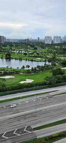 an aerial view of a swimming pool a yard and plants