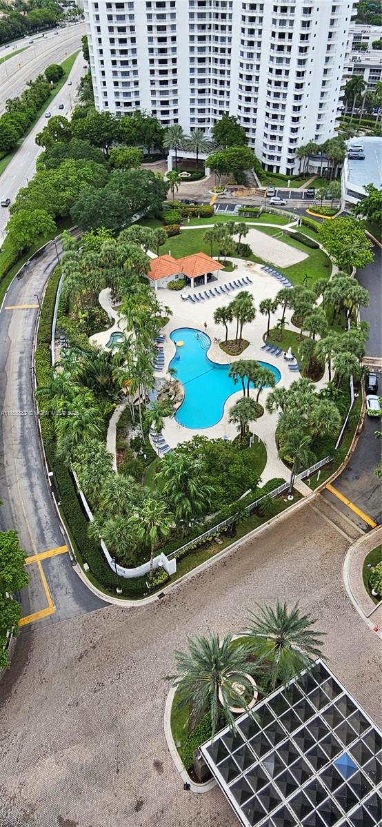 3300 Northeast 191st Street, Unit PH8 Aventura, FL 33180 - Photo 32 of 35 a view of a swimming pool with a garden