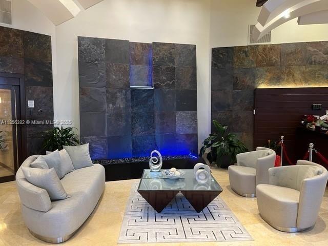 3300 Northeast 191st Street, Unit PH8 Aventura, FL 33180 - Photo 35 of 35 a living room with furniture and flowers