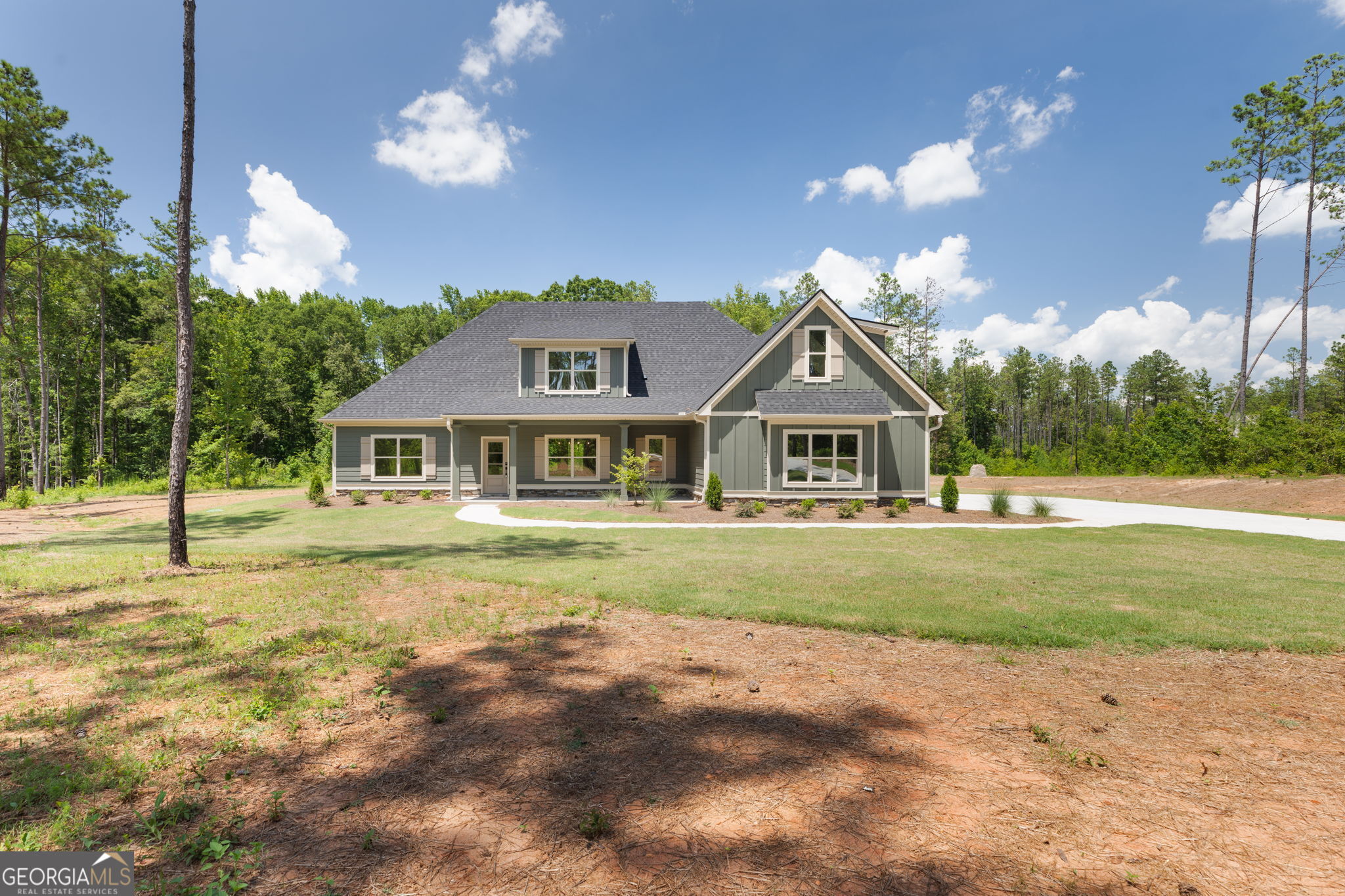 297 Bishop Road Meansville, GA 30256 - Photo 1 of 77 a front view of a house with a yard
