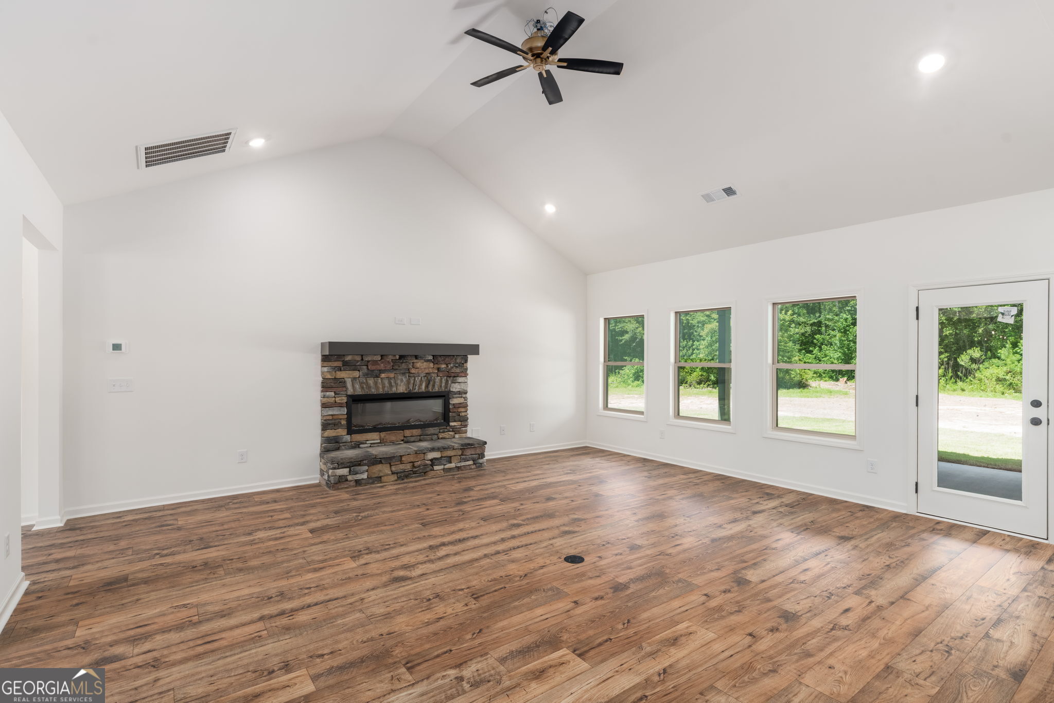297 Bishop Road Meansville, GA 30256 - Photo 11 of 77 a living room with furniture and a large window