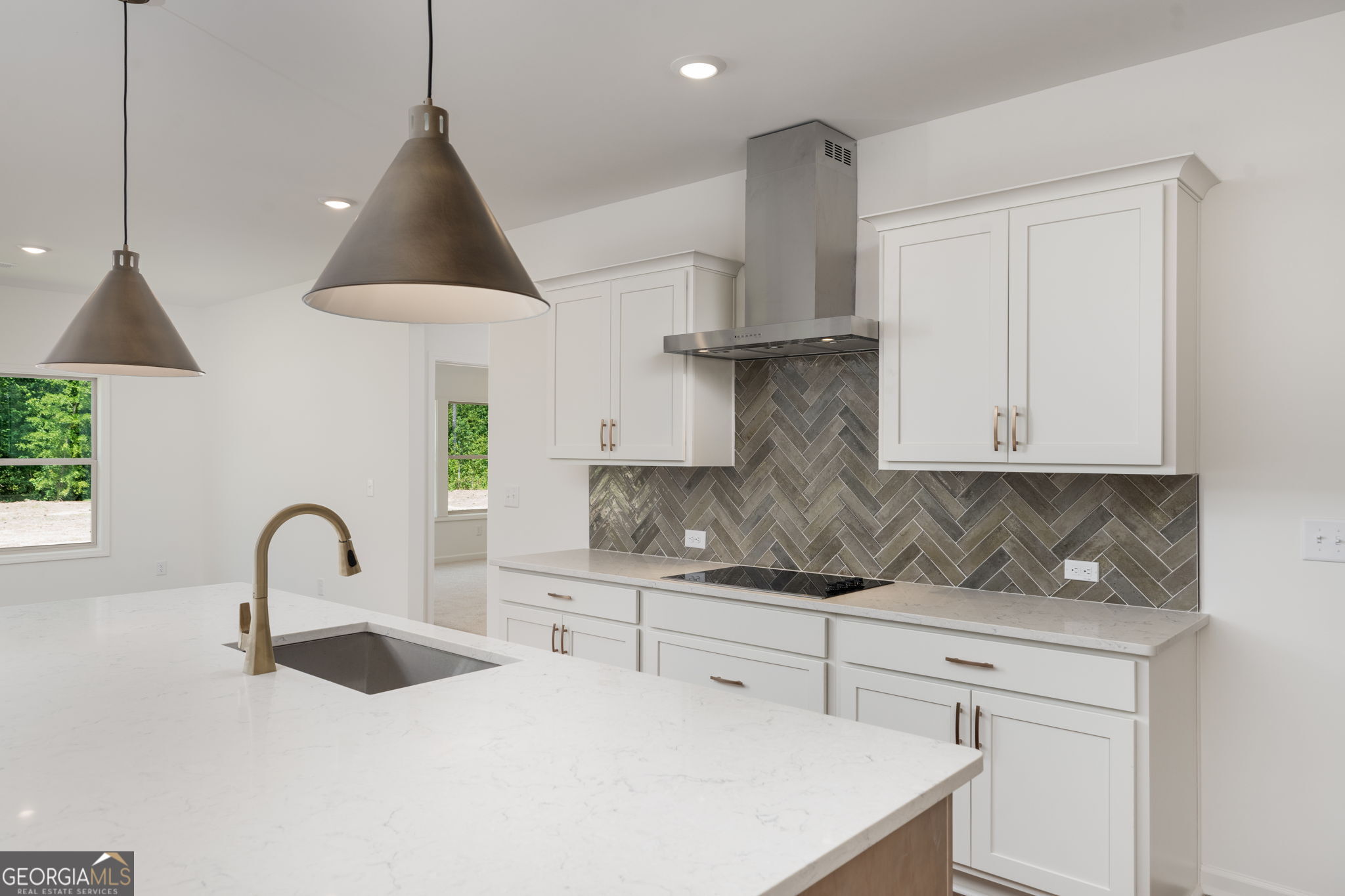 297 Bishop Road Meansville, GA 30256 - Photo 17 of 77 a kitchen with stainless steel appliances granite countertop a sink a stove and a wooden floors