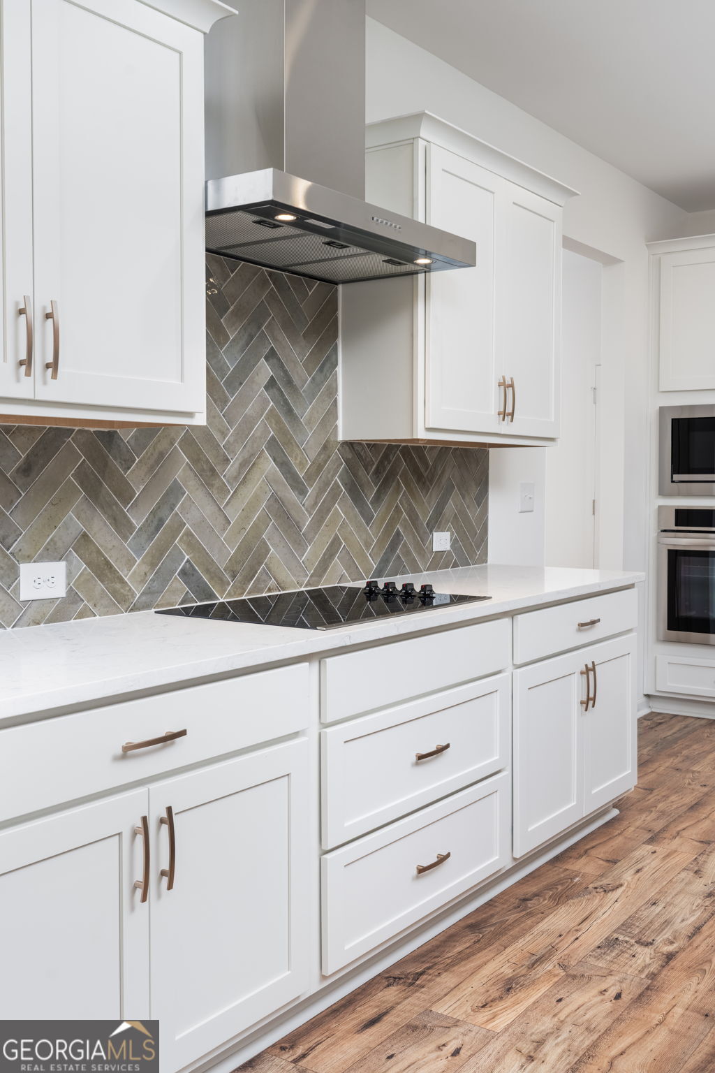 297 Bishop Road Meansville, GA 30256 - Photo 20 of 77 a kitchen with a sink and cabinets