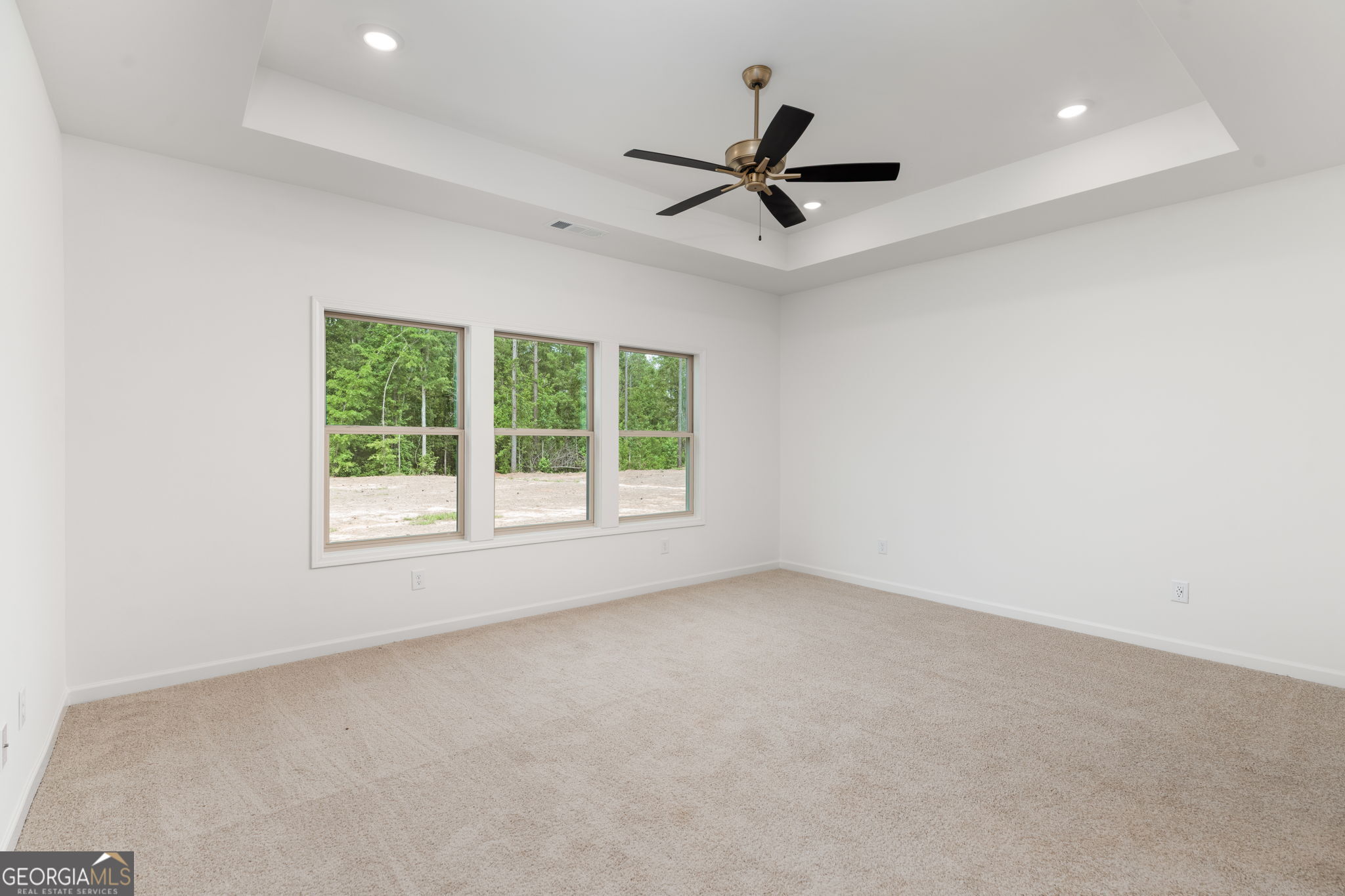 297 Bishop Road Meansville, GA 30256 - Photo 27 of 77 a view of a livingroom with a ceiling fan and window