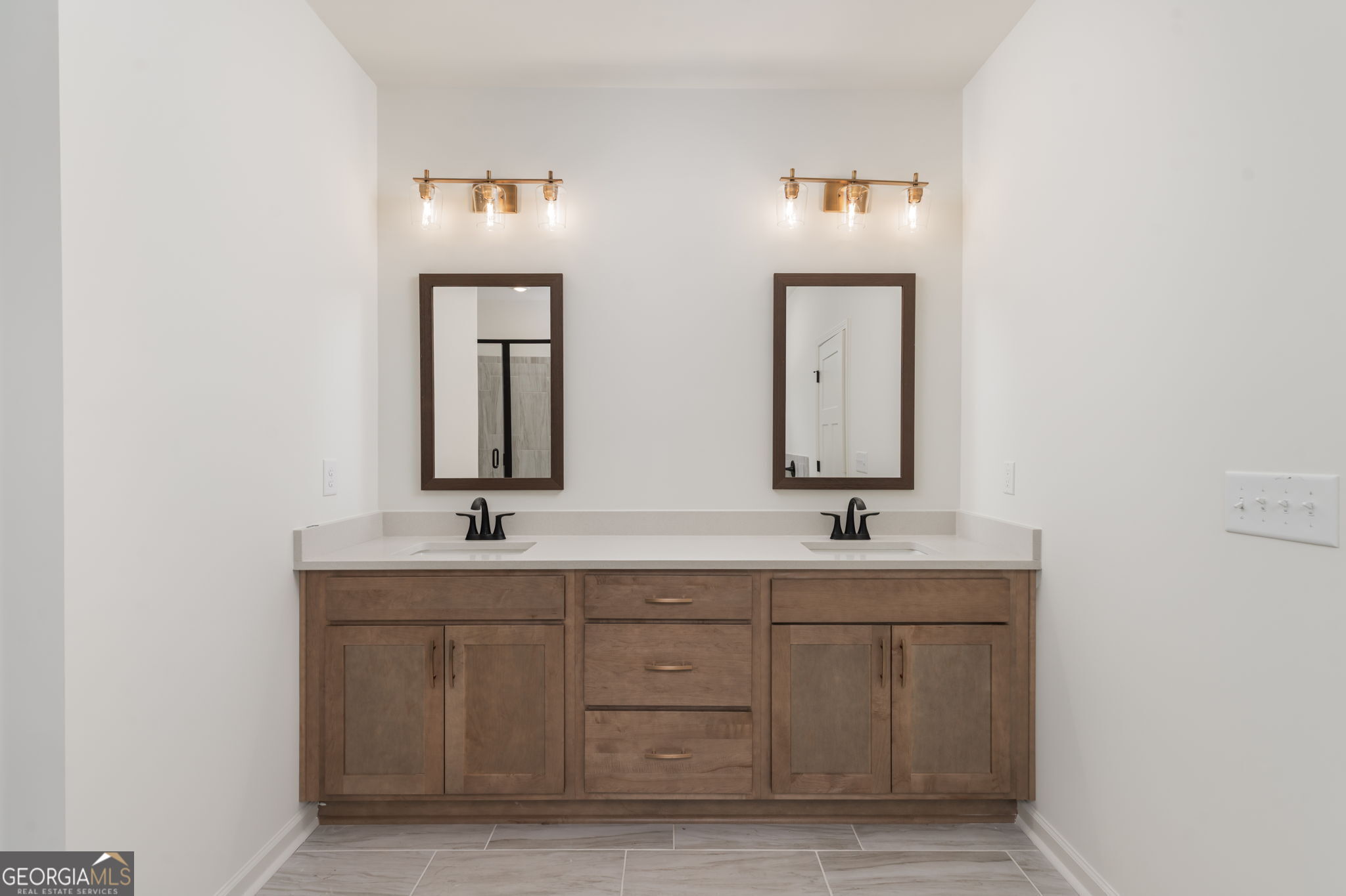 297 Bishop Road Meansville, GA 30256 - Photo 29 of 77 a bathroom with double sink and a mirror