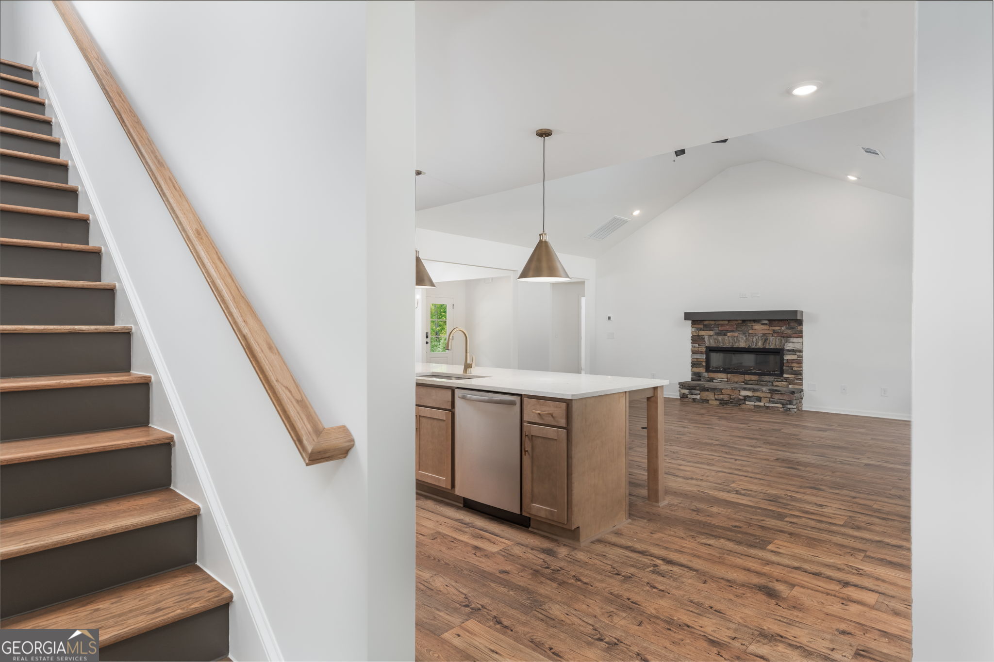 297 Bishop Road Meansville, GA 30256 - Photo 36 of 77 a view of kitchen and hall with wooden floor