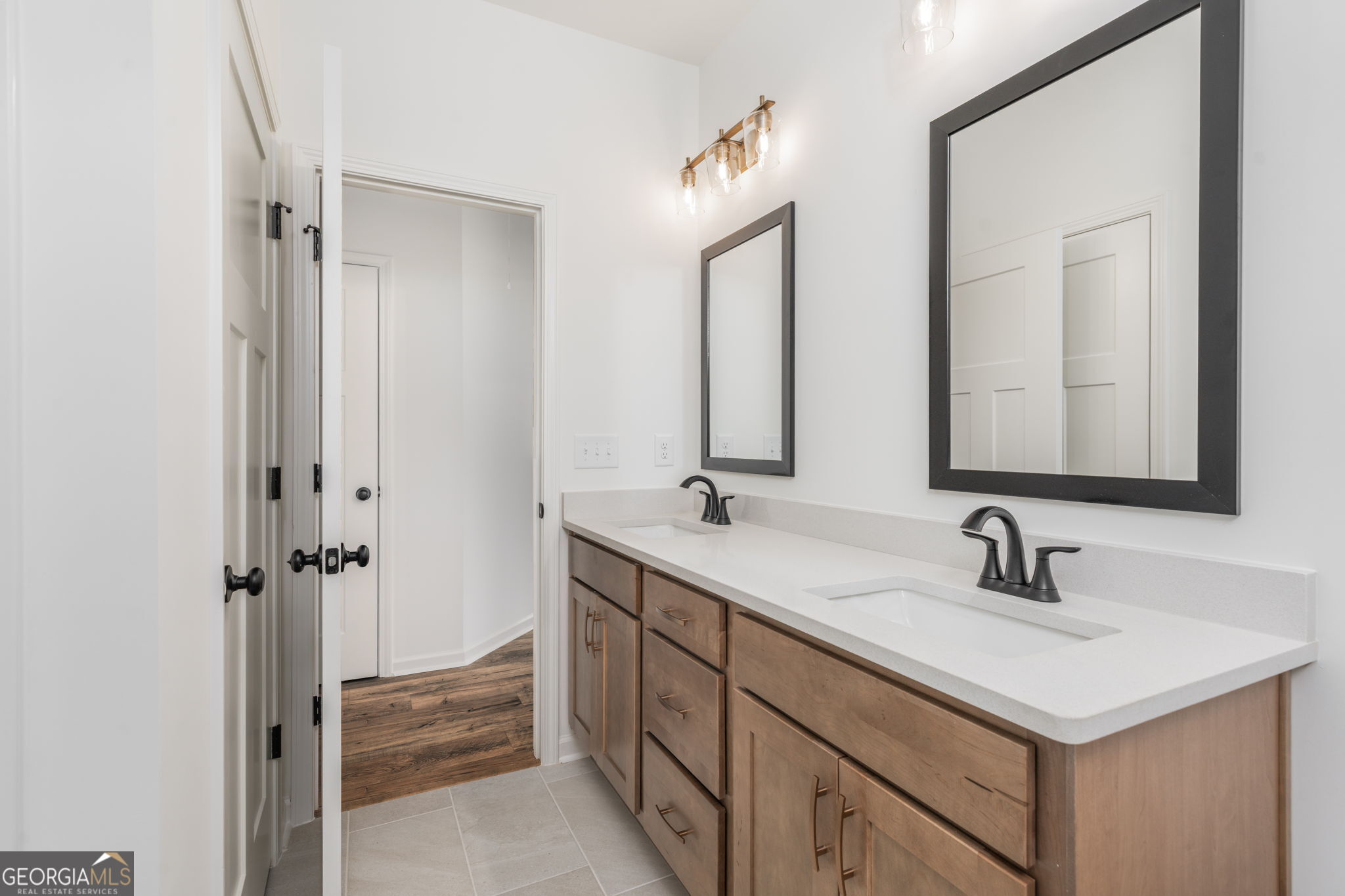 297 Bishop Road Meansville, GA 30256 - Photo 48 of 77 a bathroom with 2 sink and a mirror