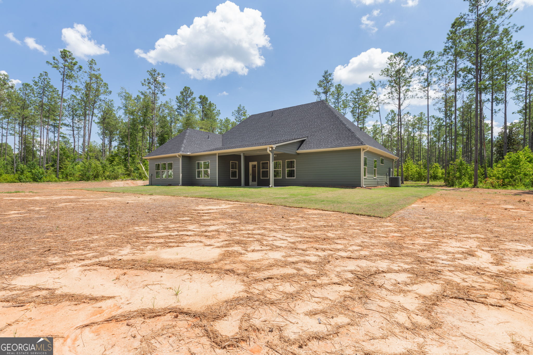 297 Bishop Road Meansville, GA 30256 - Photo 57 of 77 a house with yard in front of it