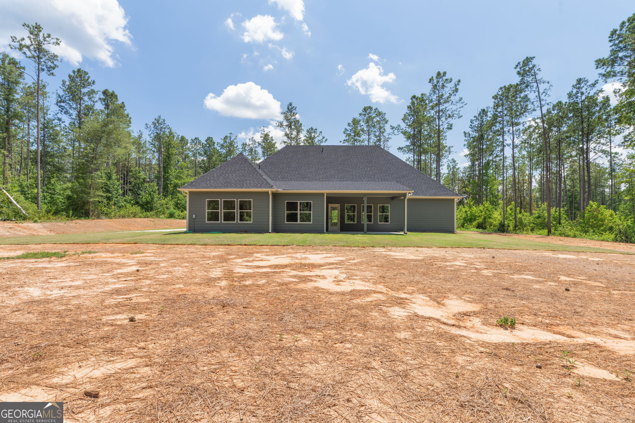 297 Bishop Road Meansville, GA 30256 - Photo 58 of 77 a view of house with yard and outdoor space