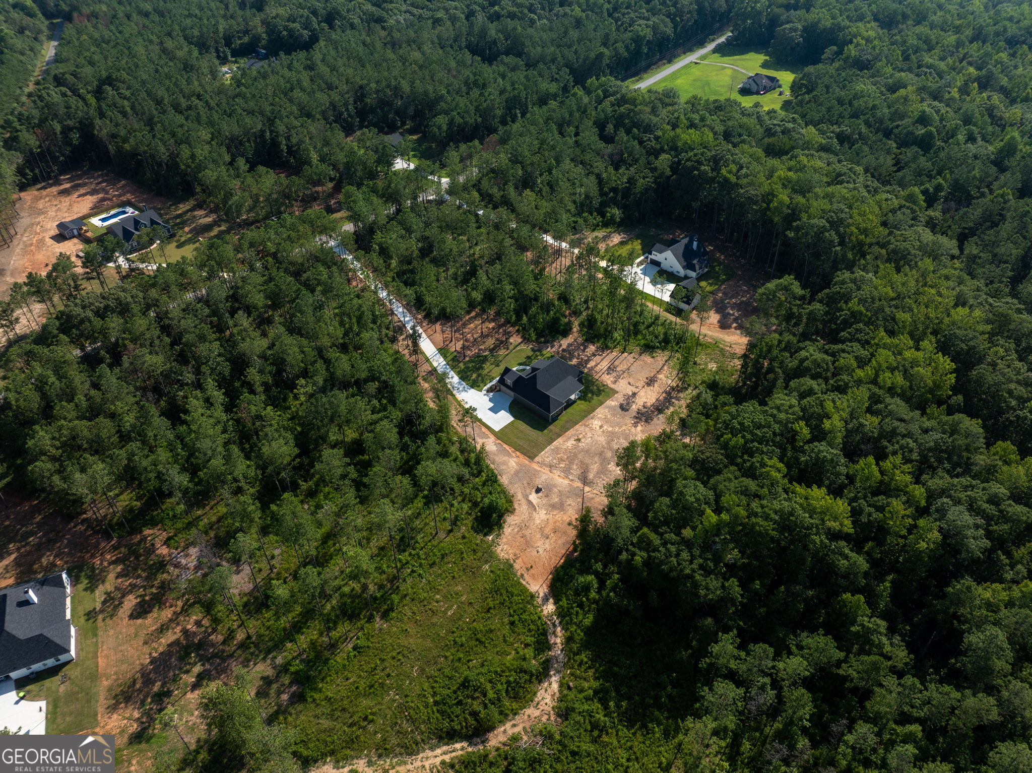 297 Bishop Road Meansville, GA 30256 - Photo 67 of 77 an aerial view of residential house with outdoor space and trees all around