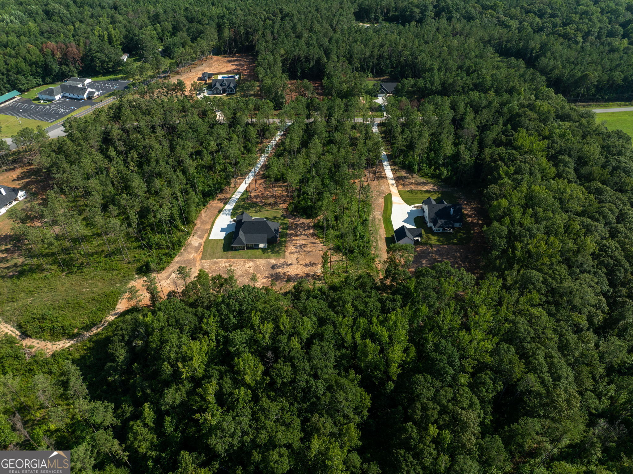 297 Bishop Road Meansville, GA 30256 - Photo 69 of 77 an aerial view of house with yard swimming pool and outdoor seating
