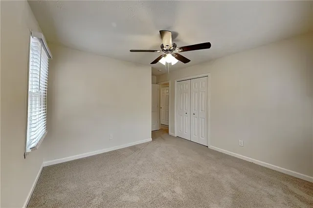 a view of empty room with windows