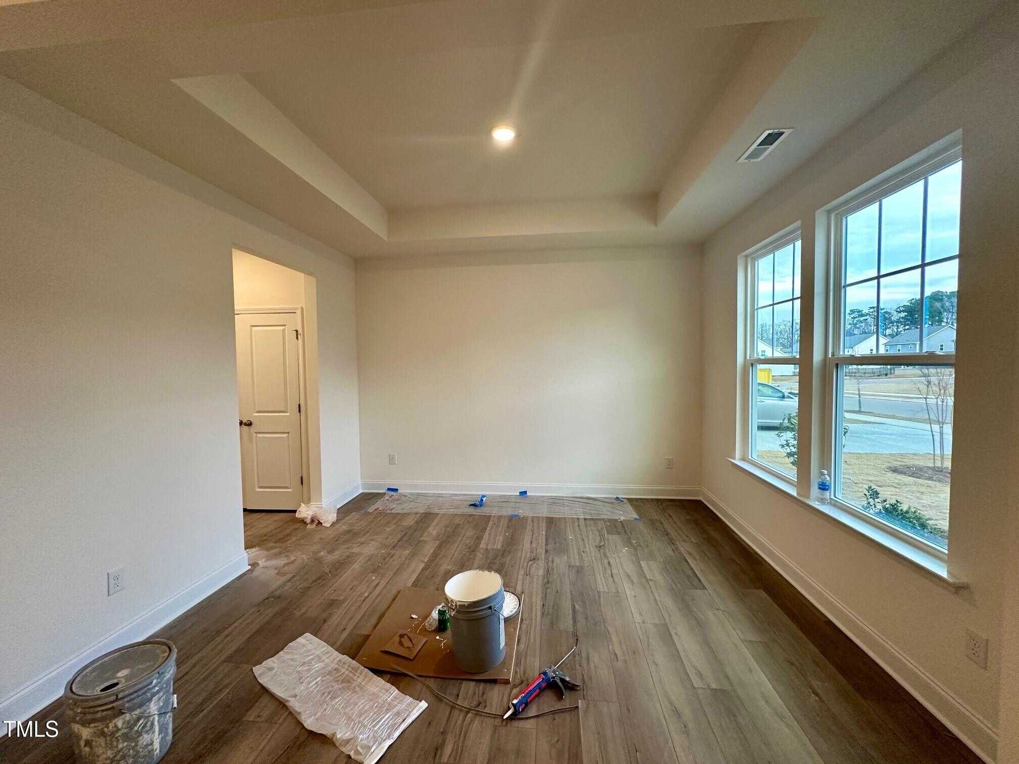 964 Channel Drop Loop Zebulon, NC 27597 - Photo 6 of 30 wooden floor in an empty room with a window