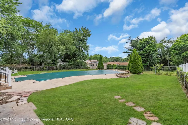 a view of a park with large trees