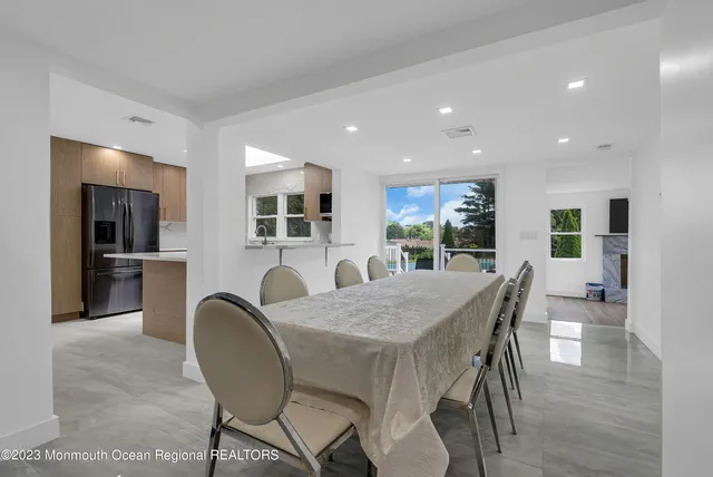 a dining room with furniture and window