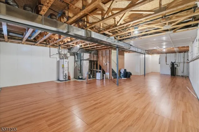 a view of a room with wooden floors