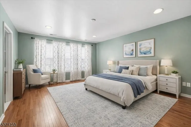 a spacious bedroom with a large bed and a couch