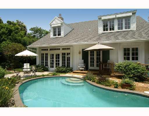 25 Ridgeview Road North Stuart, FL 34996 - Photo 1 of 8 a house view with swimming pool in front of it