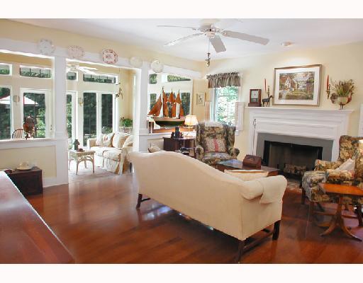 25 Ridgeview Road North Stuart, FL 34996 - Photo 2 of 8 a living room with furniture a large window and a fireplace