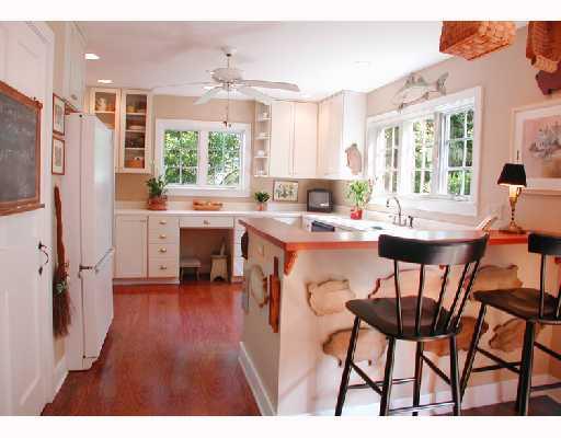 25 Ridgeview Road North Stuart, FL 34996 - Photo 4 of 8 a open dining room with stainless steel appliances kitchen island granite countertop furniture and a large window