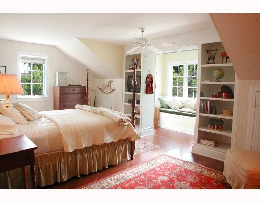 25 Ridgeview Road North Stuart, FL 34996 - Photo 7 of 8 a spacious bedroom with a bed a dresser and a large window