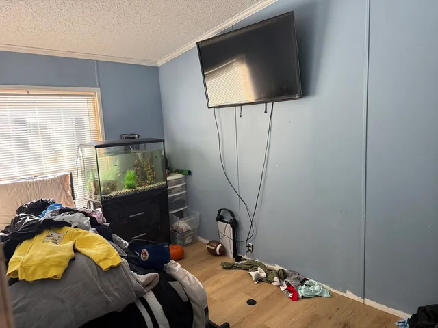a bathroom with a granite countertop sink toilet and mirror