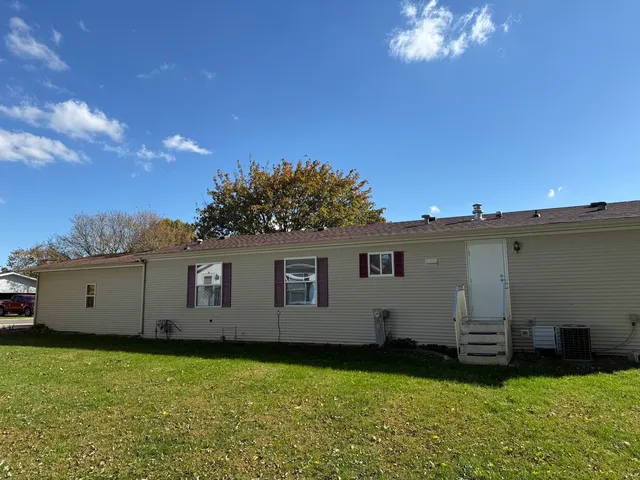 a backyard of a house with lots of green space