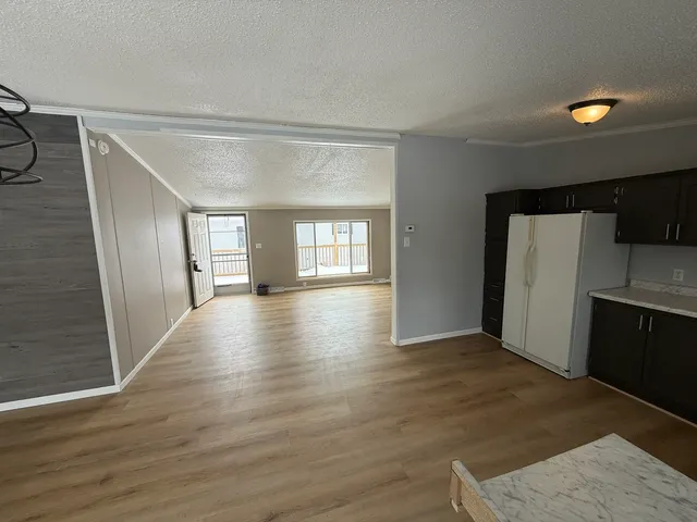 a view of a livingroom with wooden floor