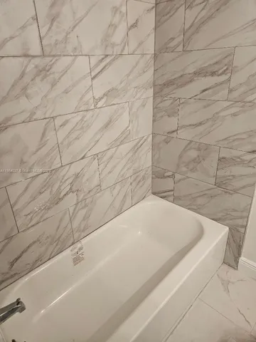 a bathroom with a bathtub