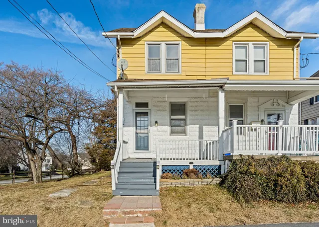 a front view of a house with a porch