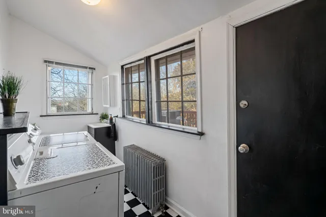 a view of a livingroom with a hardwood floor and a ceiling fan