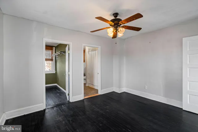 a sink with a and white wall