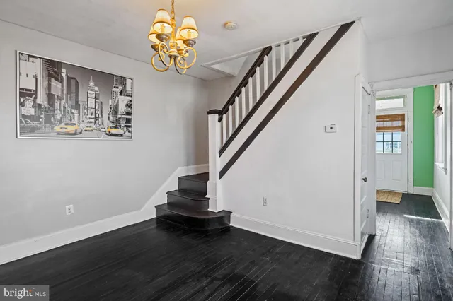 a view of entryway with wooden floor