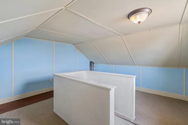 a balcony with wooden floor and fence
