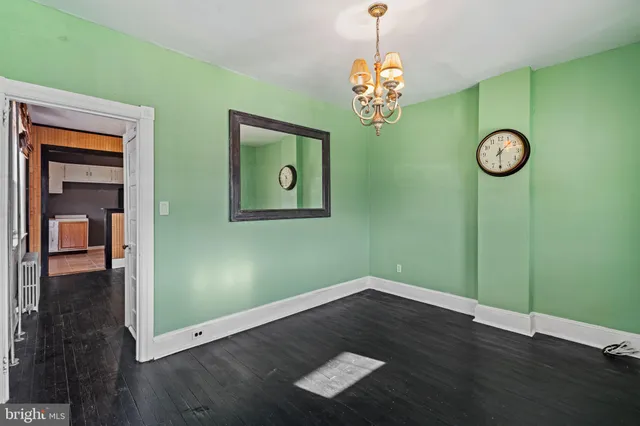 a kitchen with a refrigerator sink and cabinets