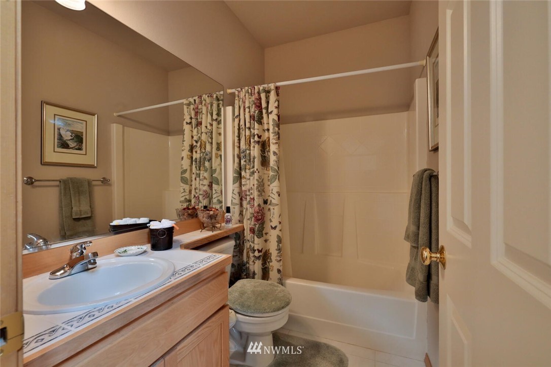 1400 North 38th Street Renton, WA 98056 - Photo 22 of 26 a bathroom with a sink toilet and shower
