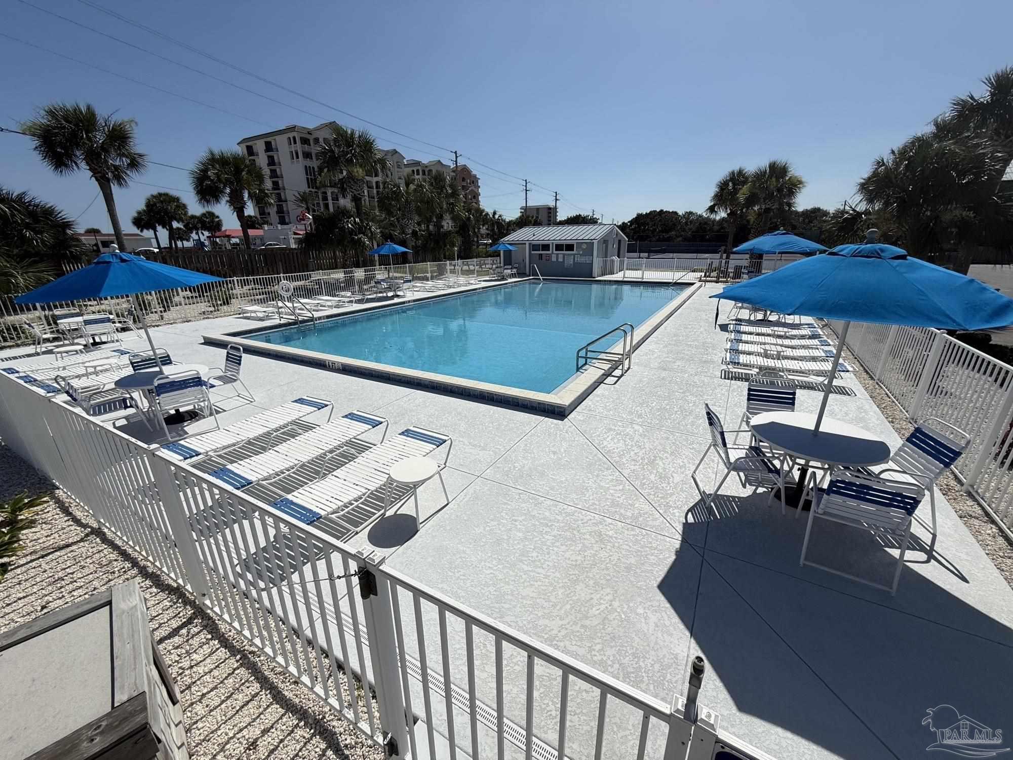 16470 Perdido Key Drive, Unit B13 Perdido Key, FL 32507 - Photo 6 of 17 a view of a swimming pool with seating area