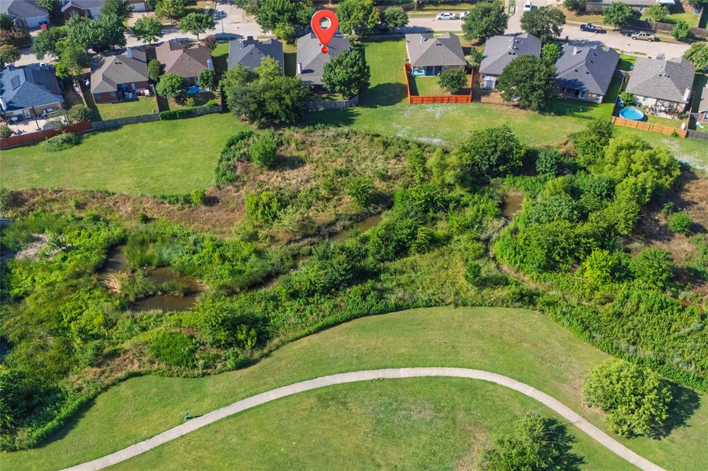 4025 Chisos Rim Trail Fort Worth, TX 76244 - Photo 3 of 40 Aerial perspective showcasing a residential neighborhood bordering a natural greenbelt with winding pathways