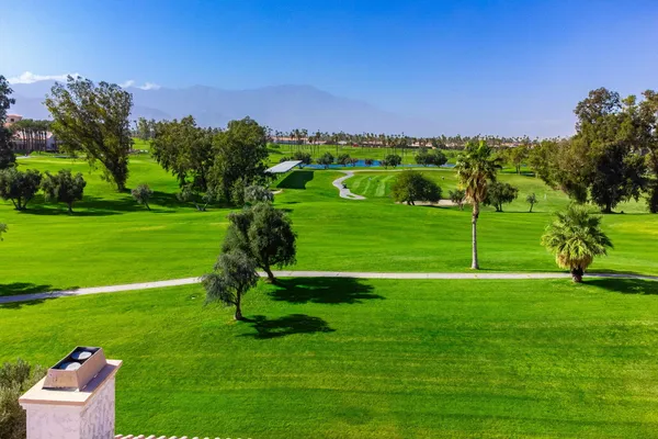 a view of a golf course with a garden